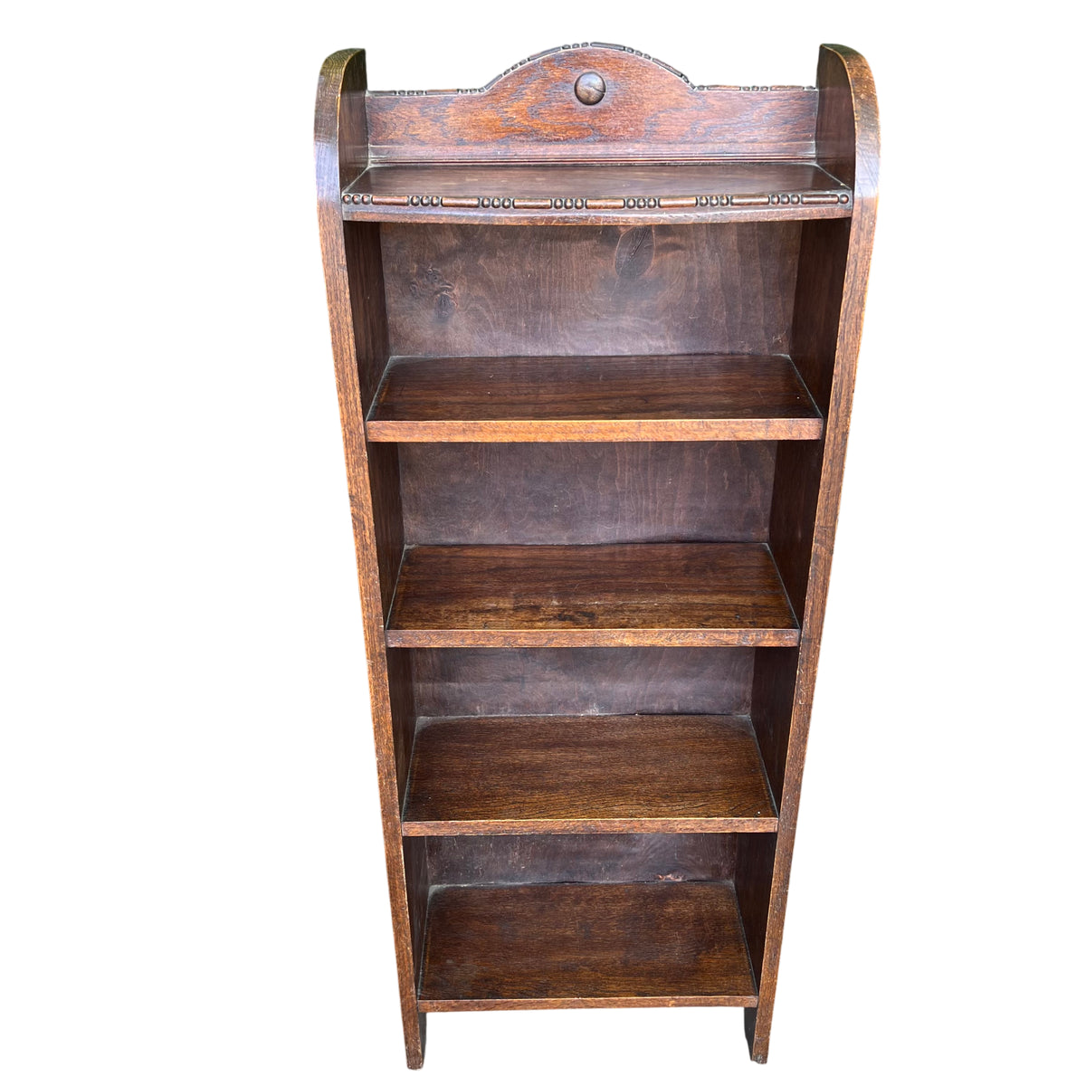 Front view oak bookshelf with shaped pediment and central turned knop