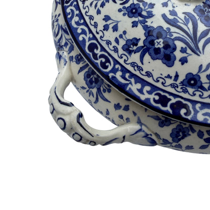 Close-up of transferware pattern showing stylised birds and floral decoration
