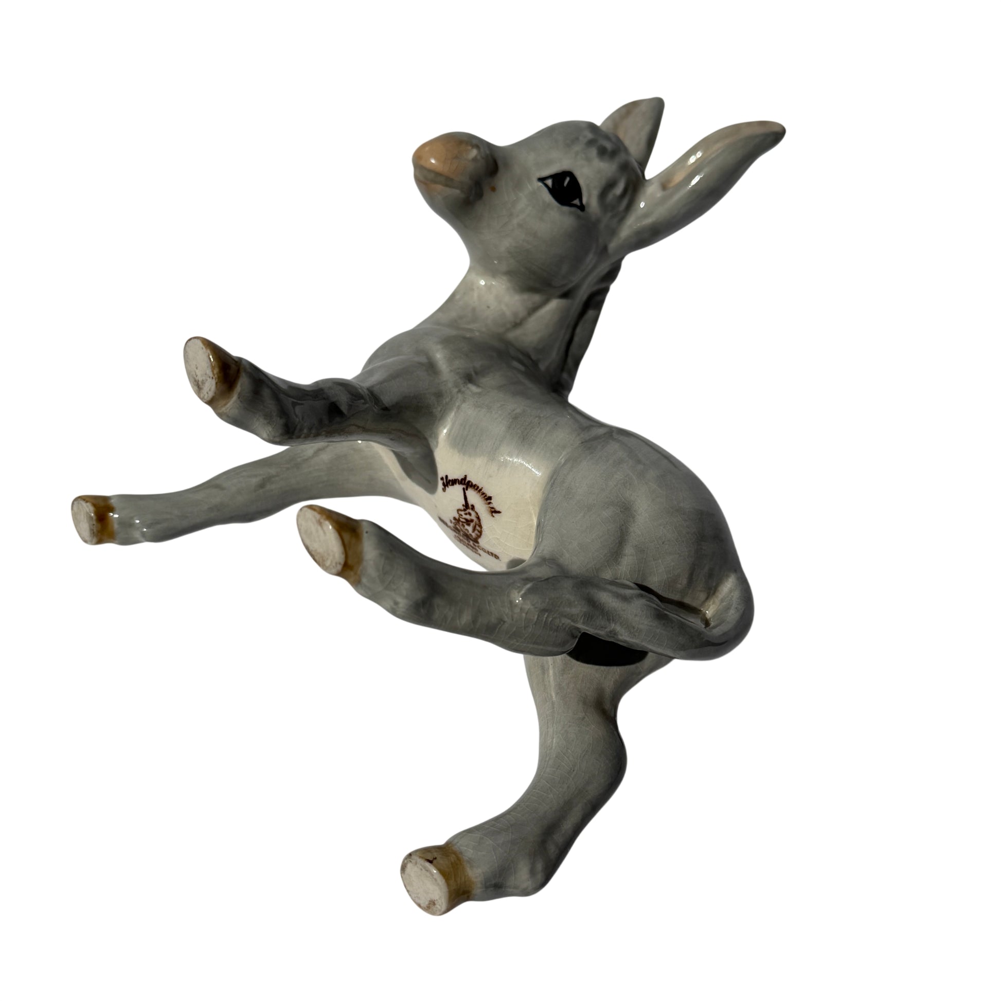 Three-quarter view of Wedgwood ceramic donkey foal figurine showing arched neck