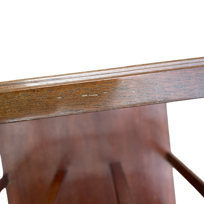 Drawer detail with metal drop handles on vintage wooden magazine rack