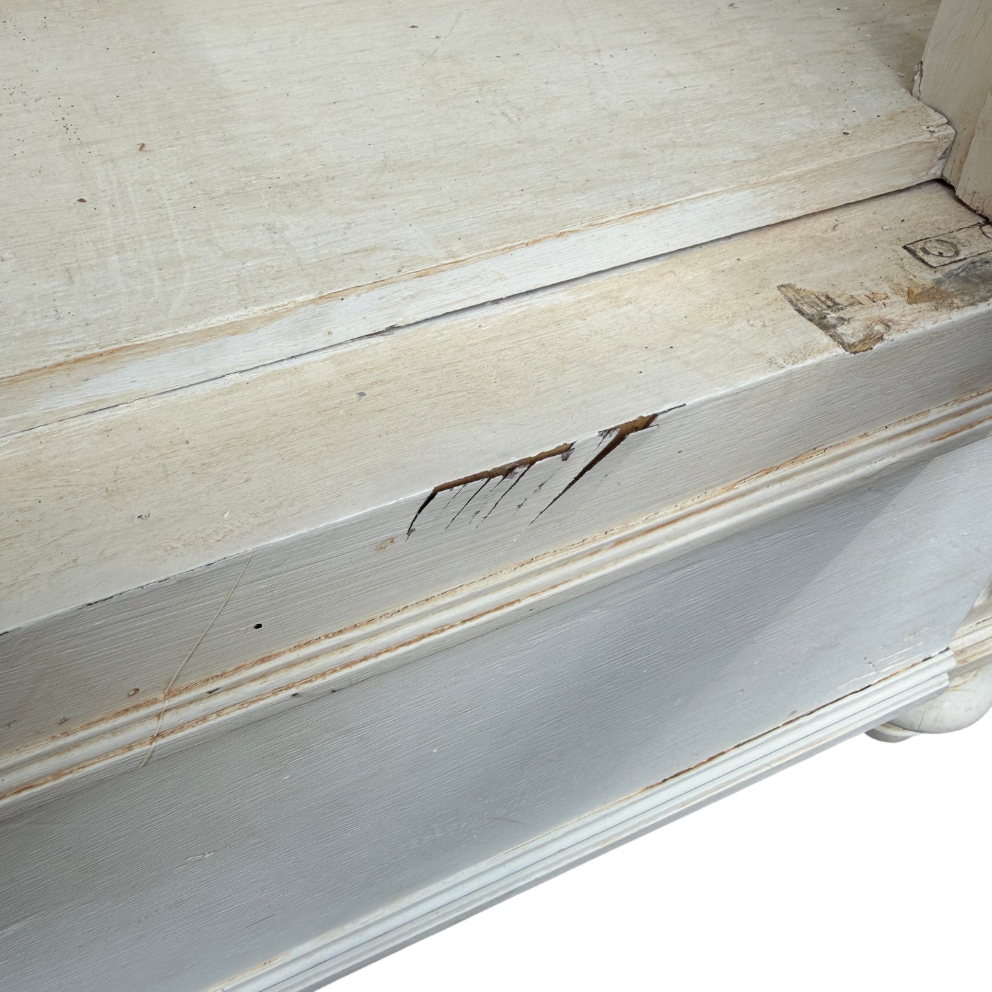 Angled shot of the French painted cabinet standing outside a vintage shop