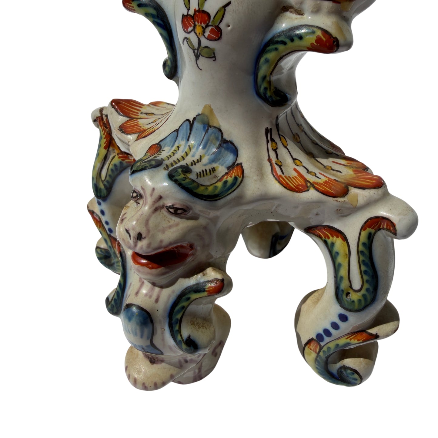 Close-up of grotesque mask on Rouen style ceramic candlestick with painted details