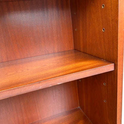 Base plinth and moulded foot of Brights of Nettlebed mahogany bookcase