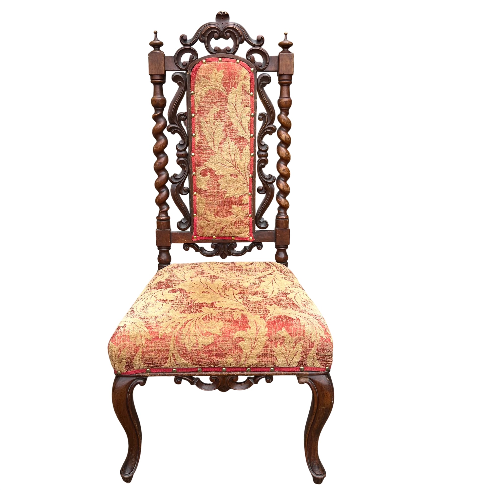 Side profile showing carved scroll and turned walnut column on antique dining chair
