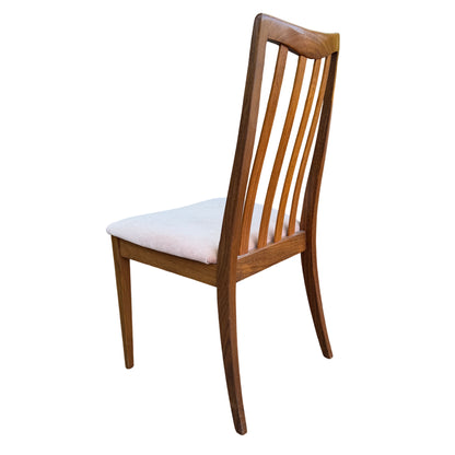 Side view showing tapered legs and seat profile of a G-Plan 1970s dining chair