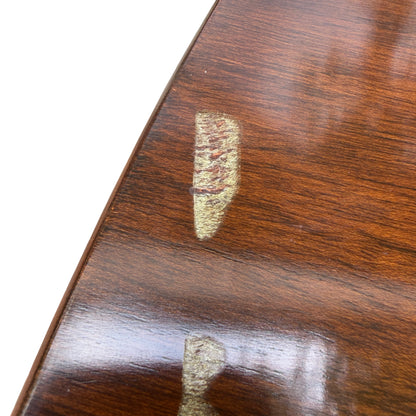 Turned central pedestal base and four curved legs of the dining table
