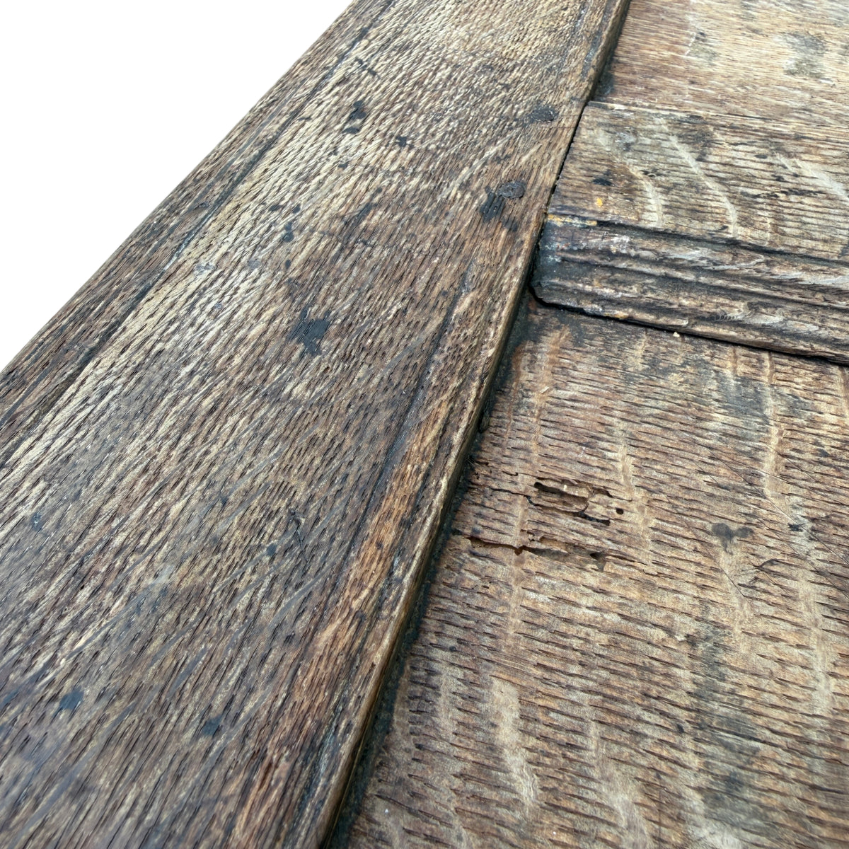 Side view of oak coffer with carved panel and carved border motifs
