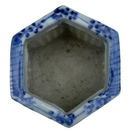 Side view of hexagonal pierced porcelain cachepot with bamboo motifs