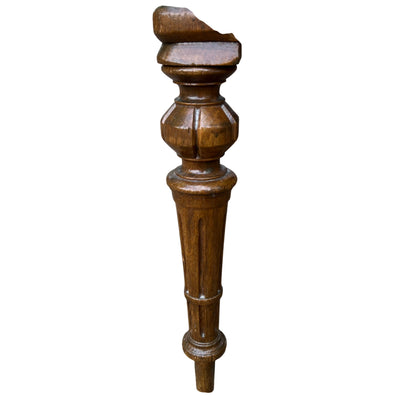 Detail of shaped centre splat and carved motif on oak dining chair back