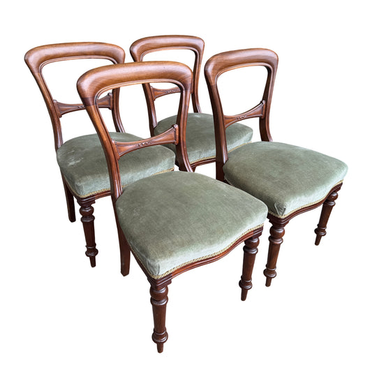 Set of four Victorian mahogany dining chairs with green upholstered seats and turned front legs