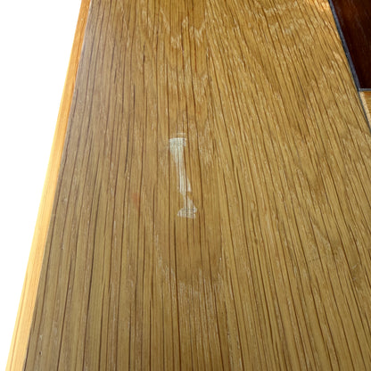 Close-up of leg and lower plinth of solid oak bedside cabinet