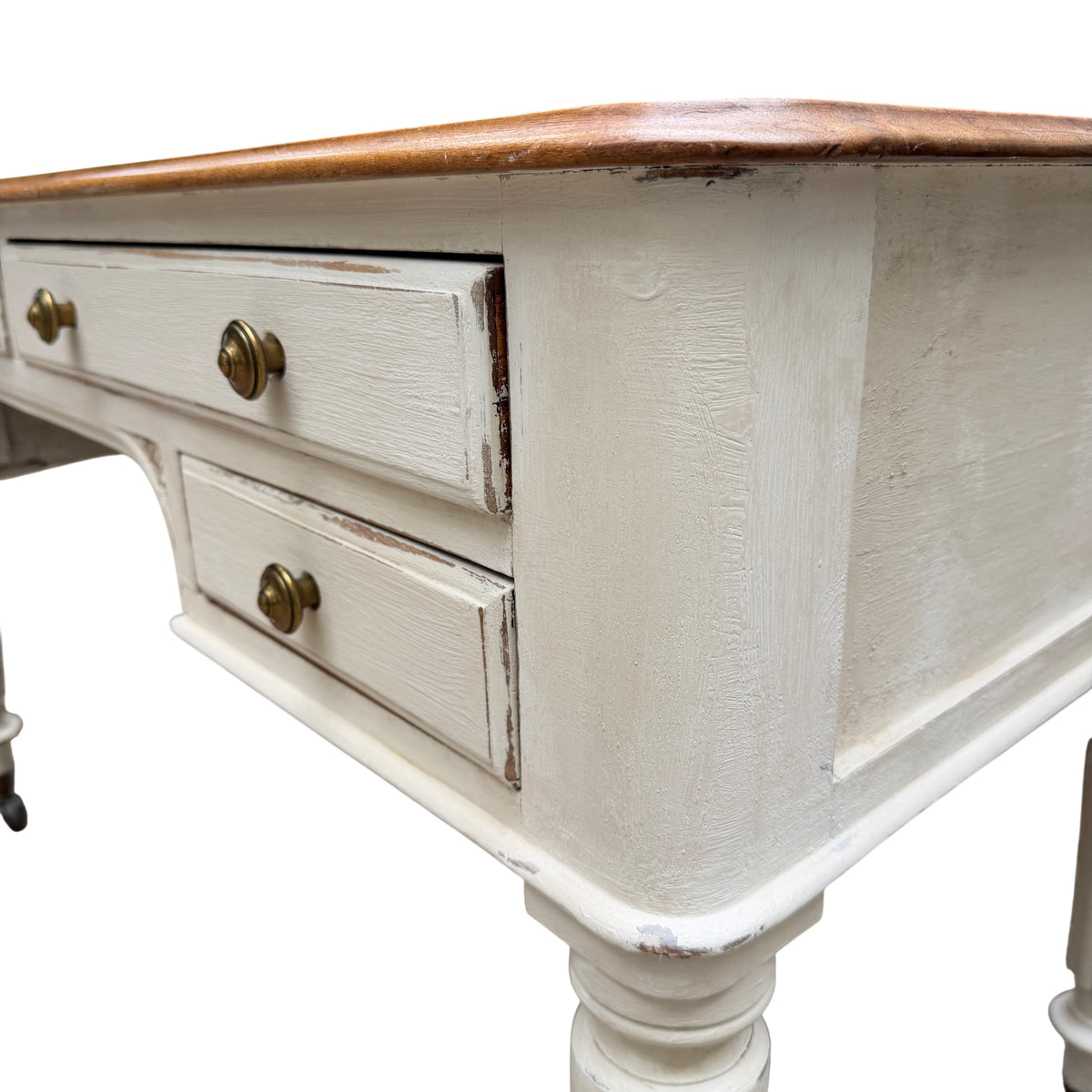 Turned leg and original castor of a painted vintage dressing table