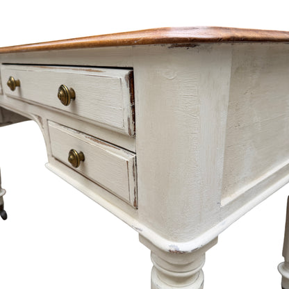 Turned leg and original castor of a painted vintage dressing table