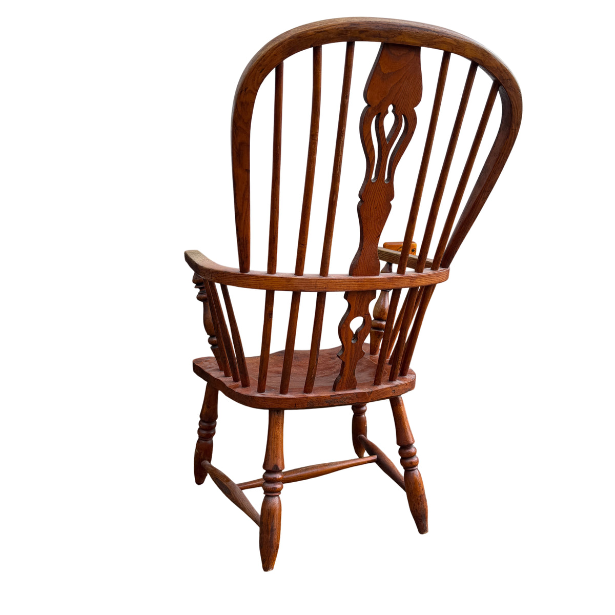 Detailed view of arm top showing wear to finish on oak armchair