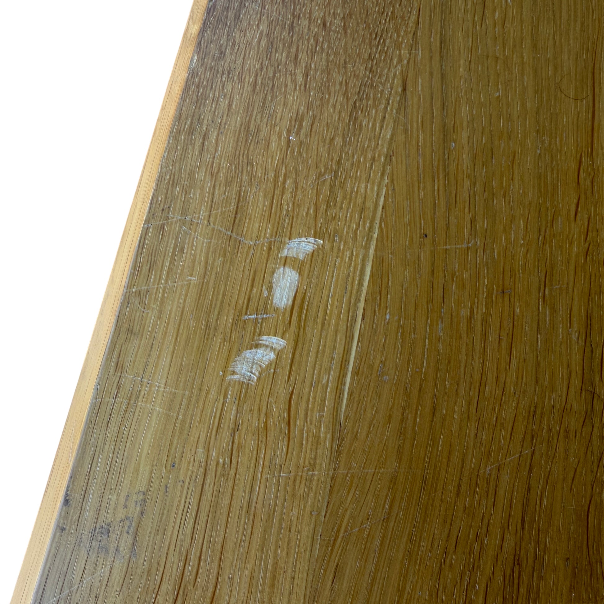 Side view of contemporary oak bedside cabinet showing squared leg construction