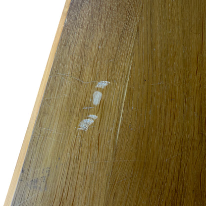 Side view of contemporary oak bedside cabinet showing squared leg construction