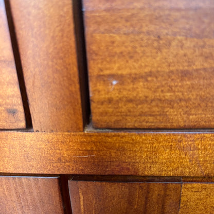 Full front view of compact two-door oak cabinet with trimmed panels
