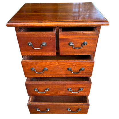 Lower drawers of stained hardwood chest with metal handles and dovetailed look fronts