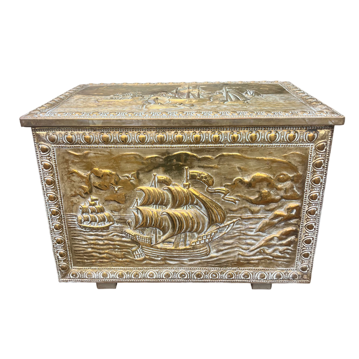 Vintage brass embossed storage chest with sailing ship motif and hinged lid