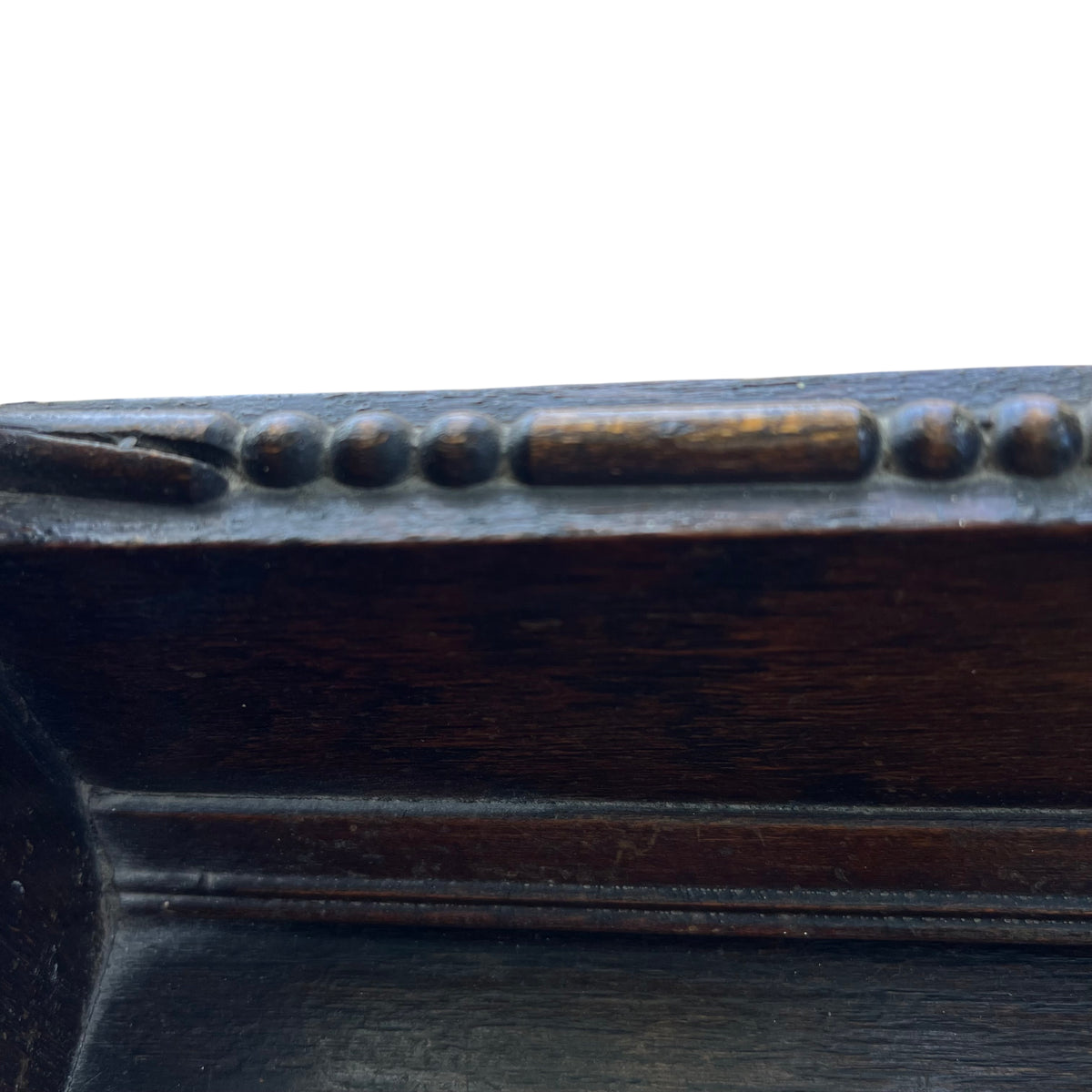 Top of bookcase with shaped pediment and small turned decorative knob