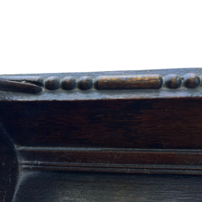 Top of bookcase with shaped pediment and small turned decorative knob