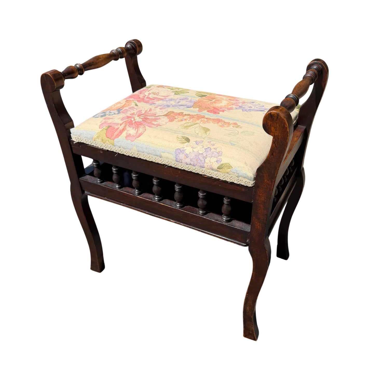 Victorian upholstered dressing stool with floral fabric seat and turned spindle gallery in dark wood