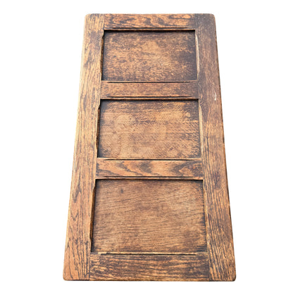 Corner detail of oak chest top with worn finish and edge moulding
