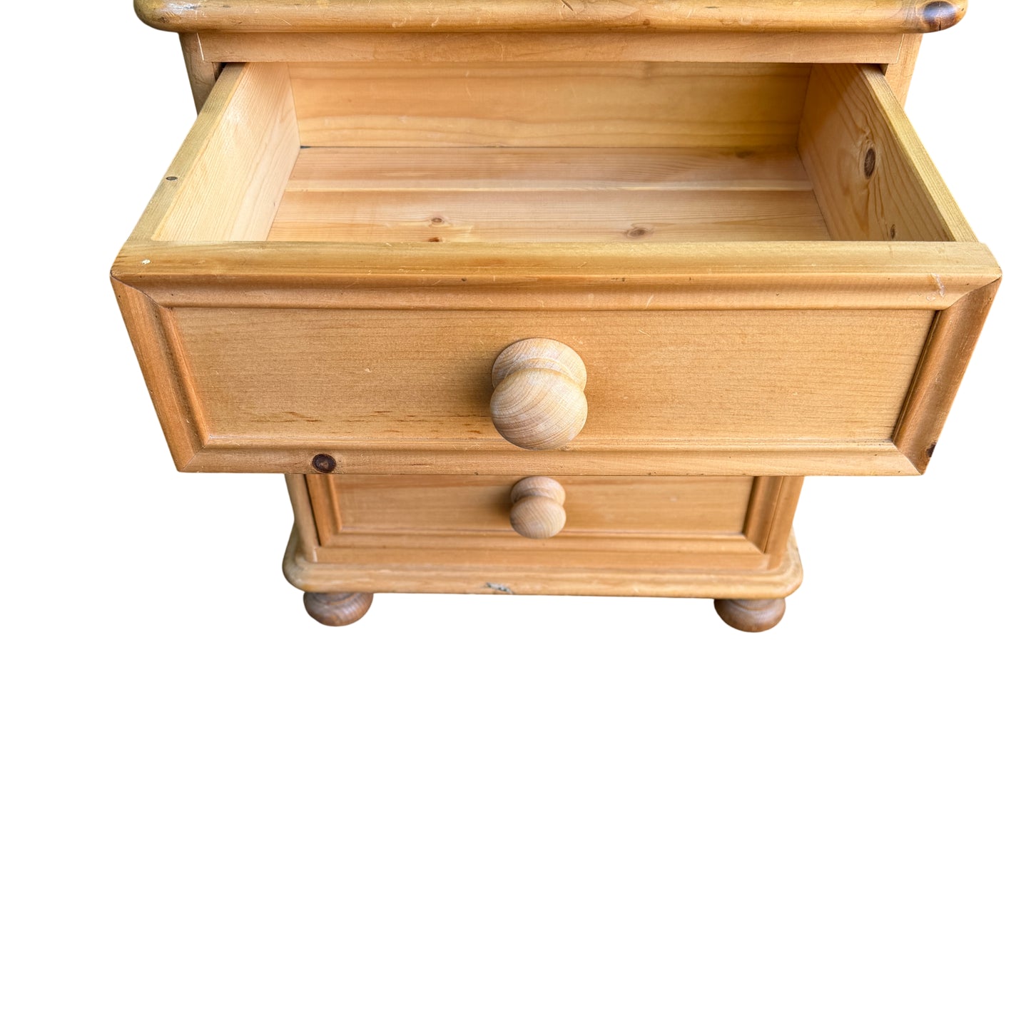 Top-down view showing knots and surface marks on pine cabinet top