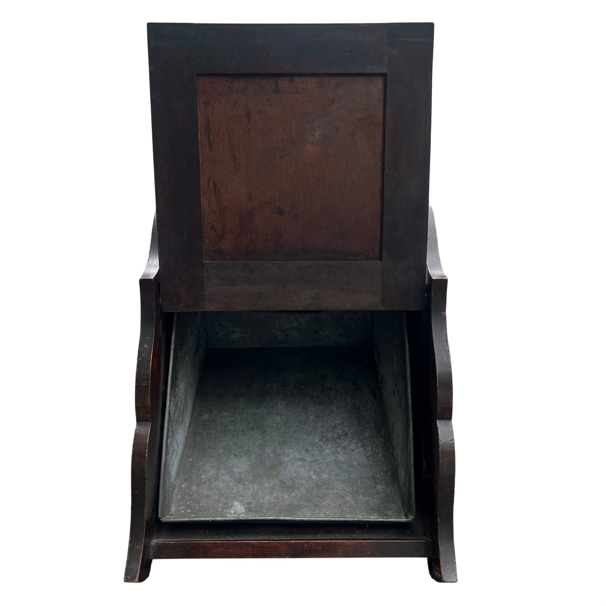 Detailed carved panel on front of wooden coal scuttle with floral and draped carving