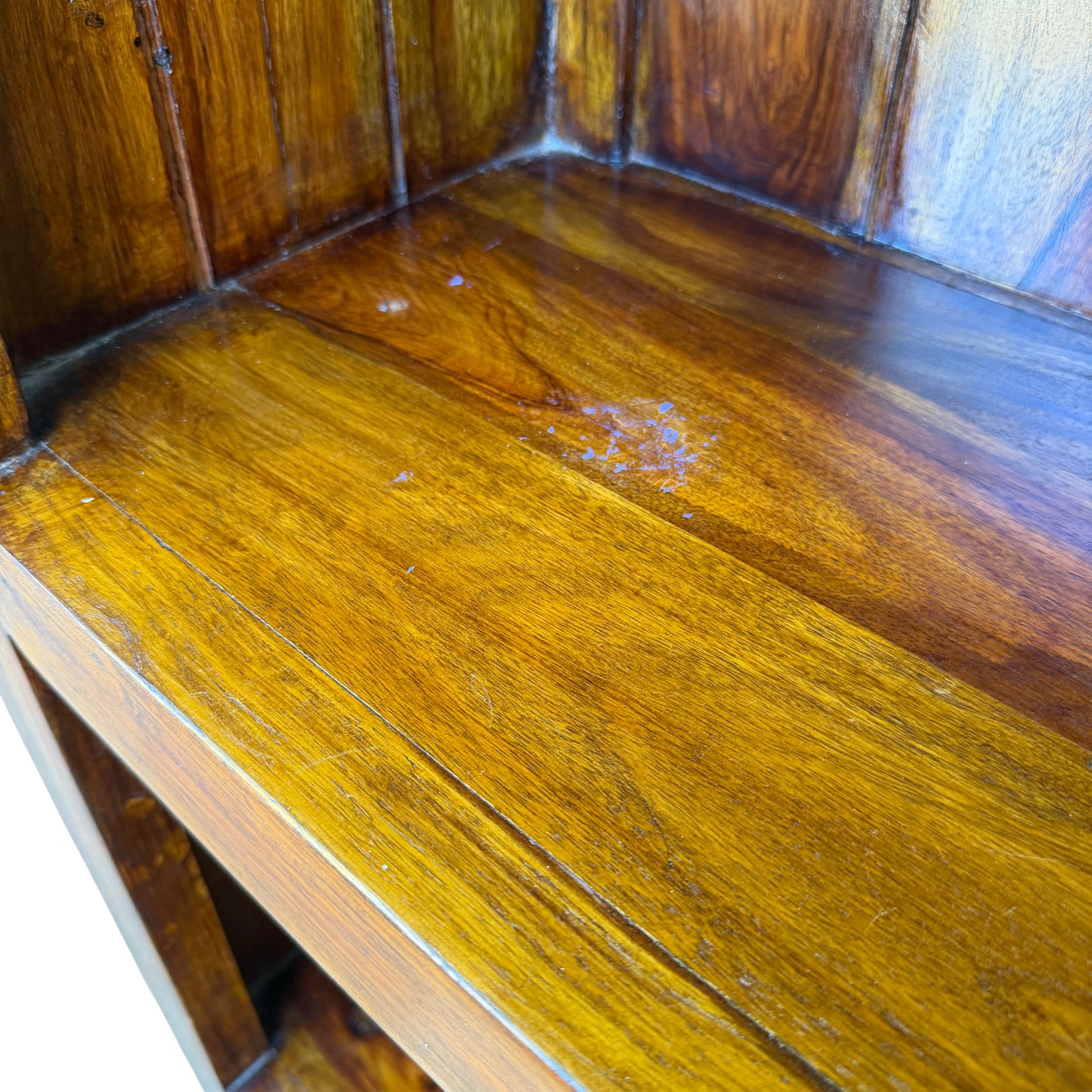 Lower section and drawer of tall hardwood bookcase with black metal handle