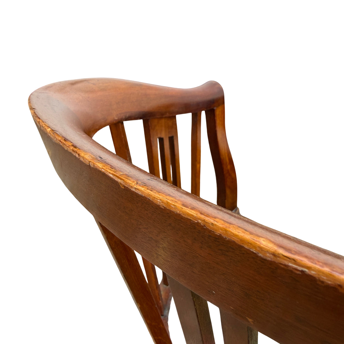 Underside view showing frame construction and shaped apron on wooden armchair