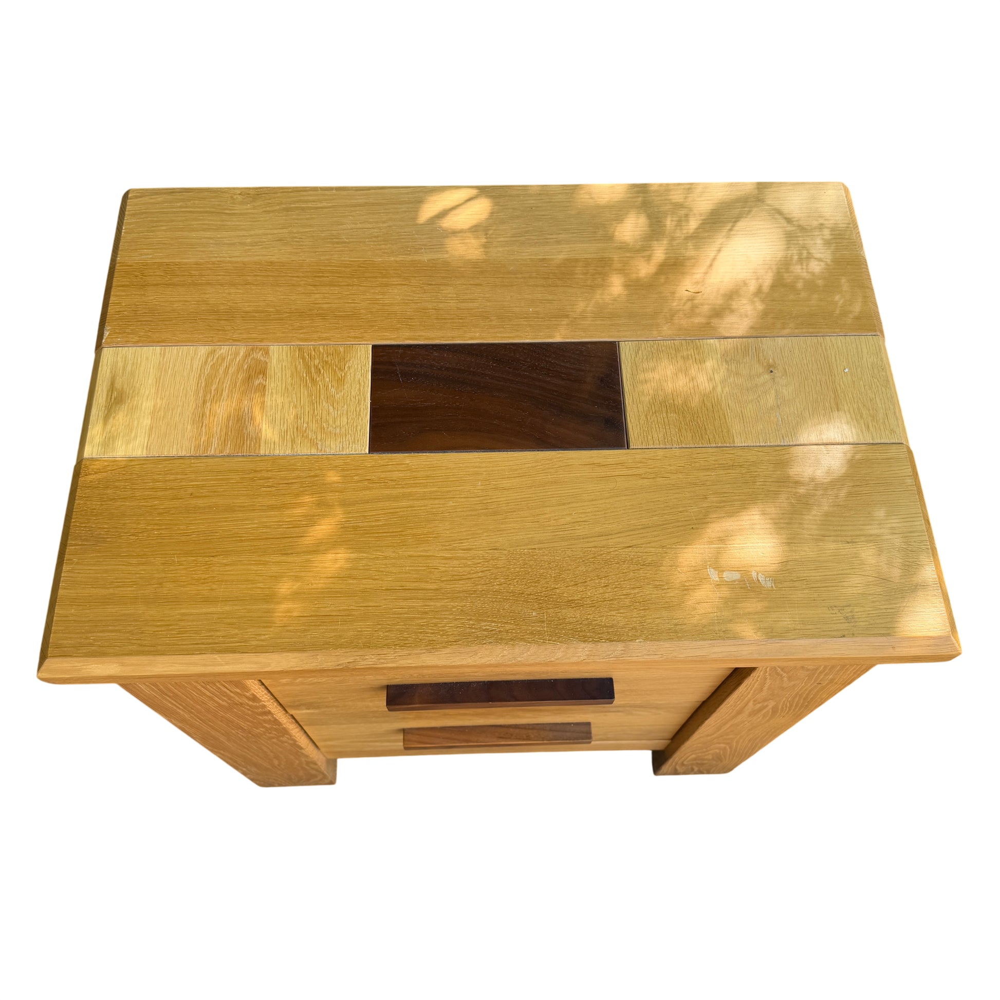Detail of scuffed top on oak bedside cabinet showing surface scratches