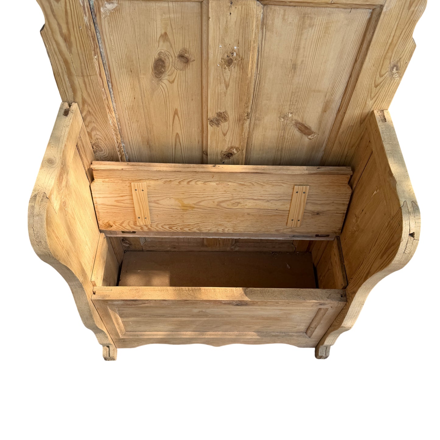 Interior view of lift-up seat storage compartment in pine bench