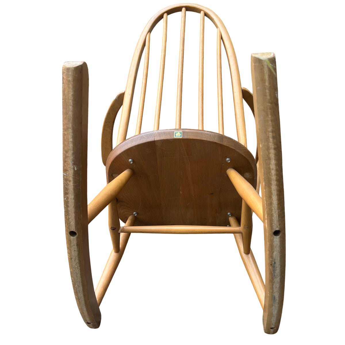Full front view of spindle-back wooden rocking chair with rockers and turned legs