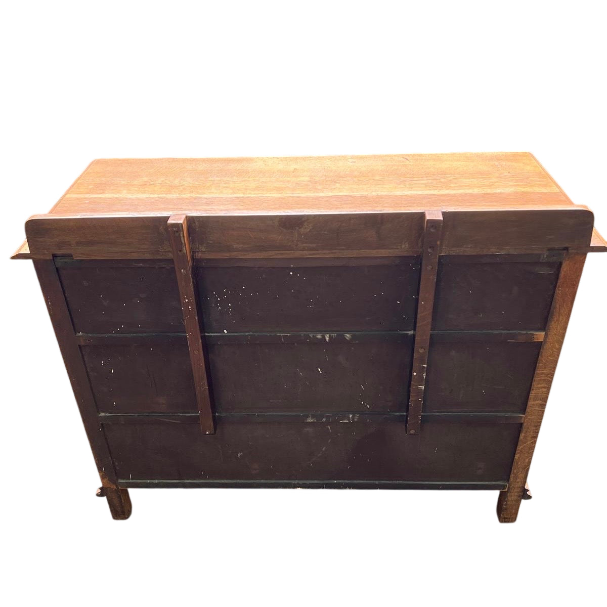 Three long drawers of oak dresser with original keyholes visible