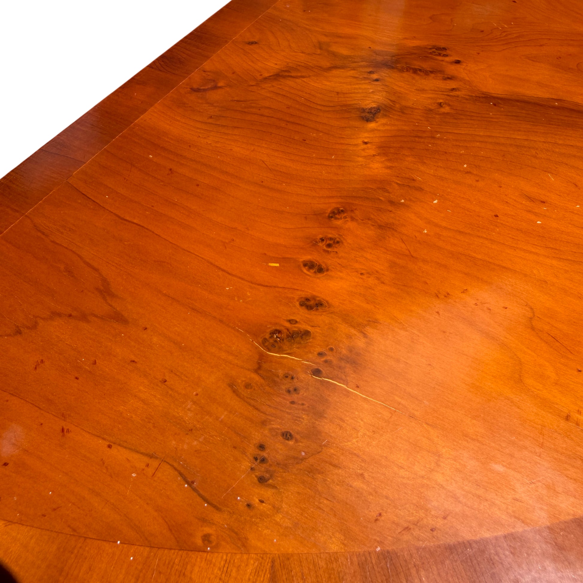 Top-down view of half-moon mahogany veneer grain on demi-lune console table