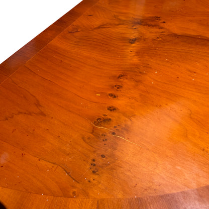 Top-down view of half-moon mahogany veneer grain on demi-lune console table