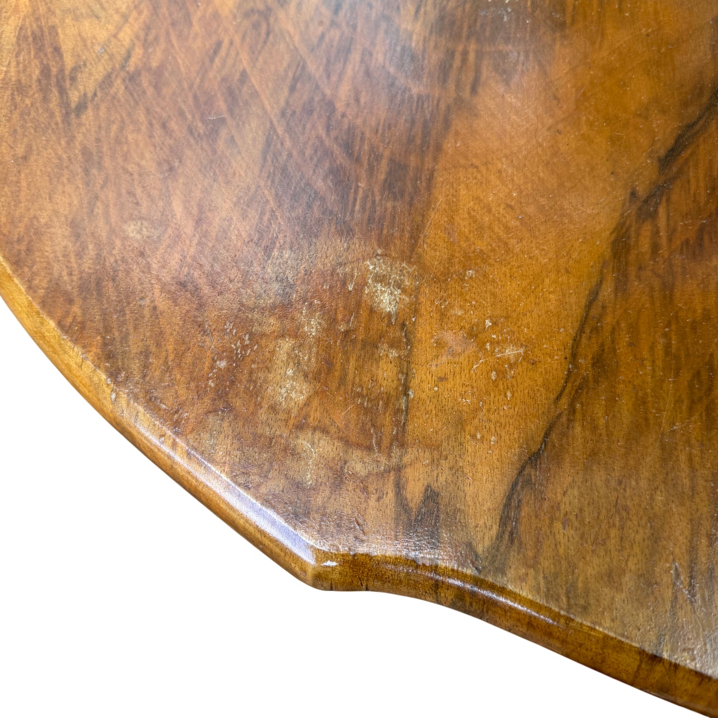 Top view of walnut veneer demilune hall table showing wood grain