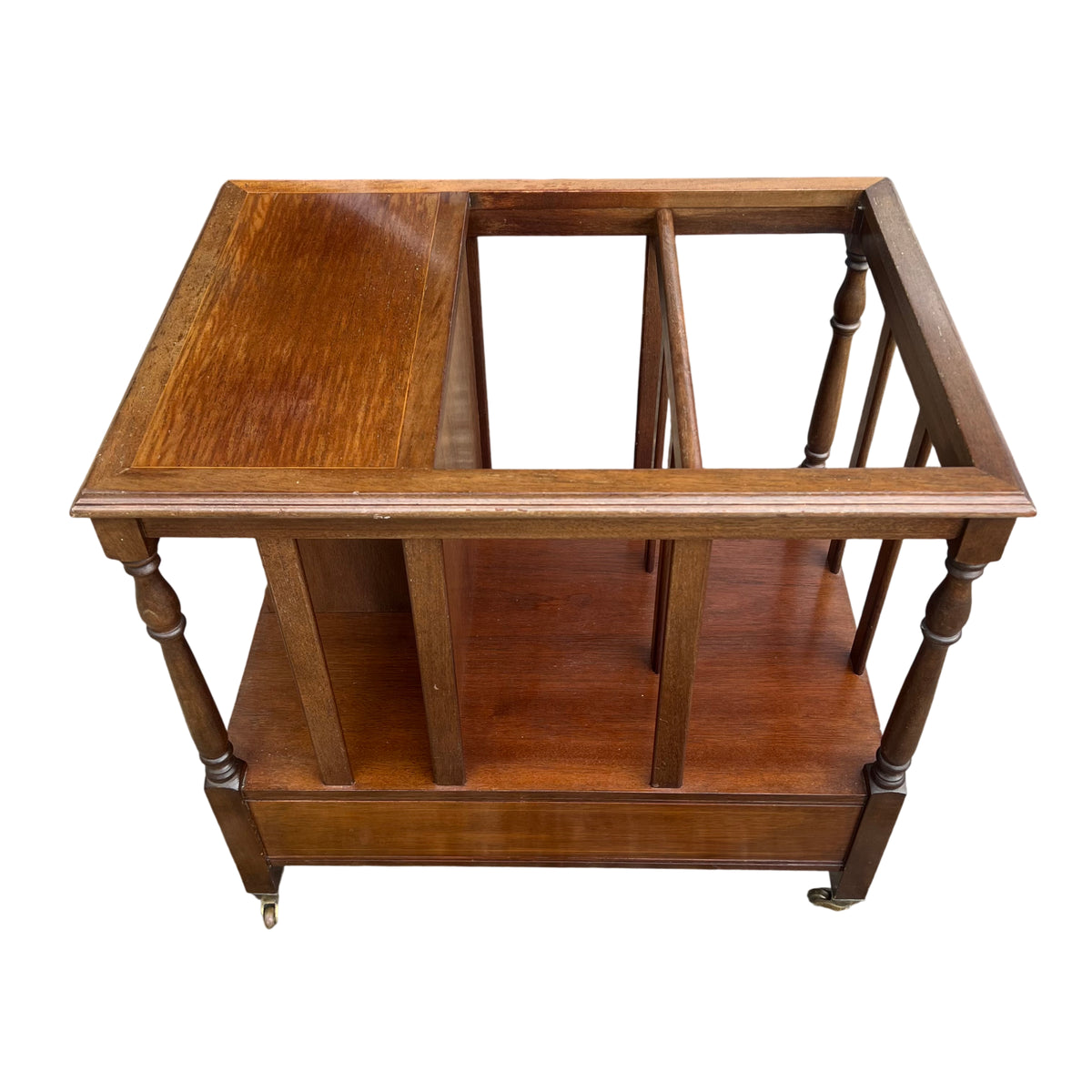 Side view of Mid Century magazine rack showing moulded top edge and castor