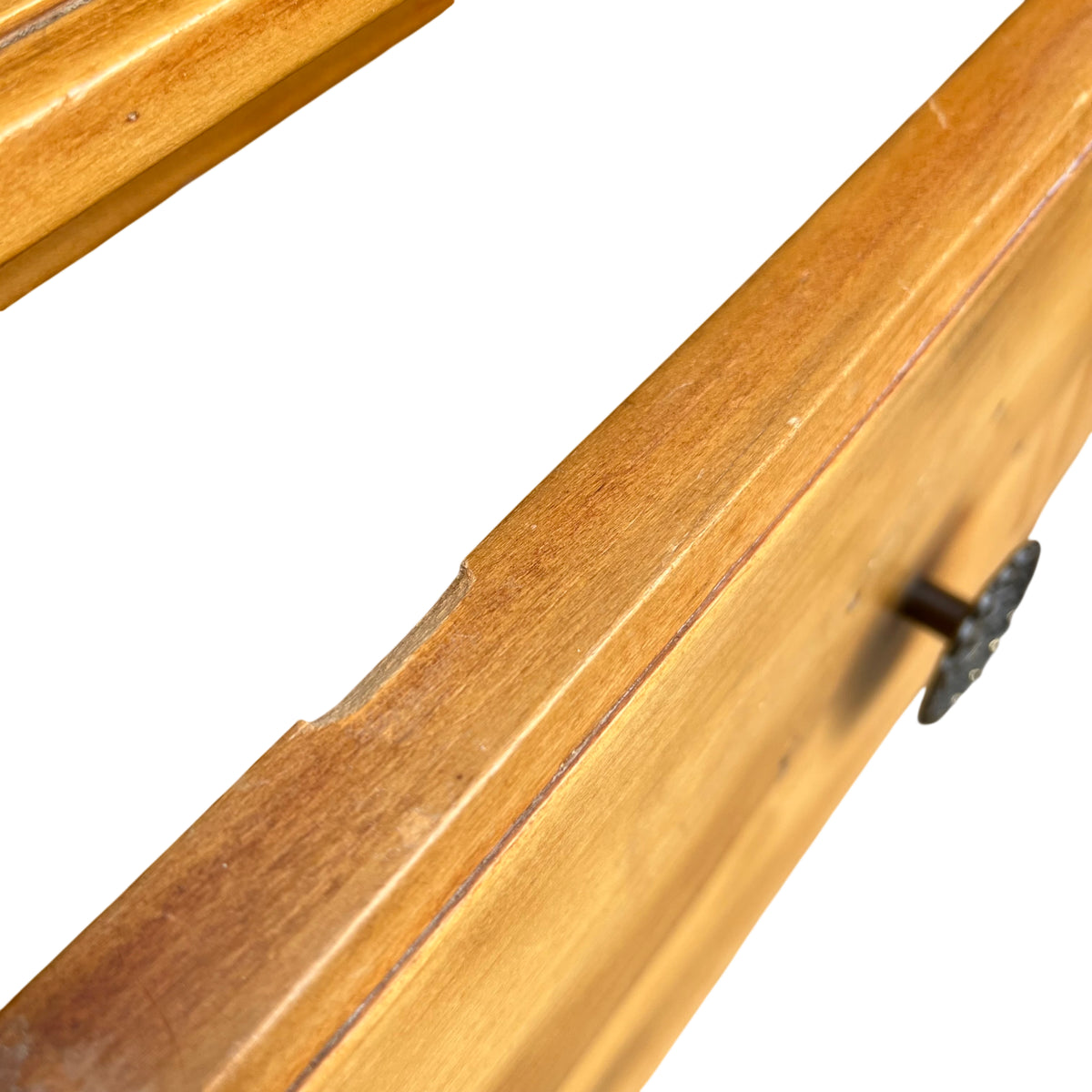 Three-quarter view of antique-style pine chest of drawers