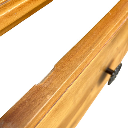 Three-quarter view of antique-style pine chest of drawers