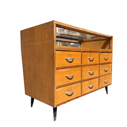 Mid Century shop counter display cabinet with glazed glass top and twelve drawers
