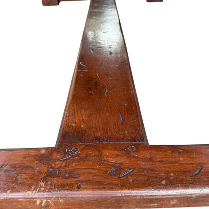 Side elevation of solid oak farmhouse table showing turned pedestals and stretcher