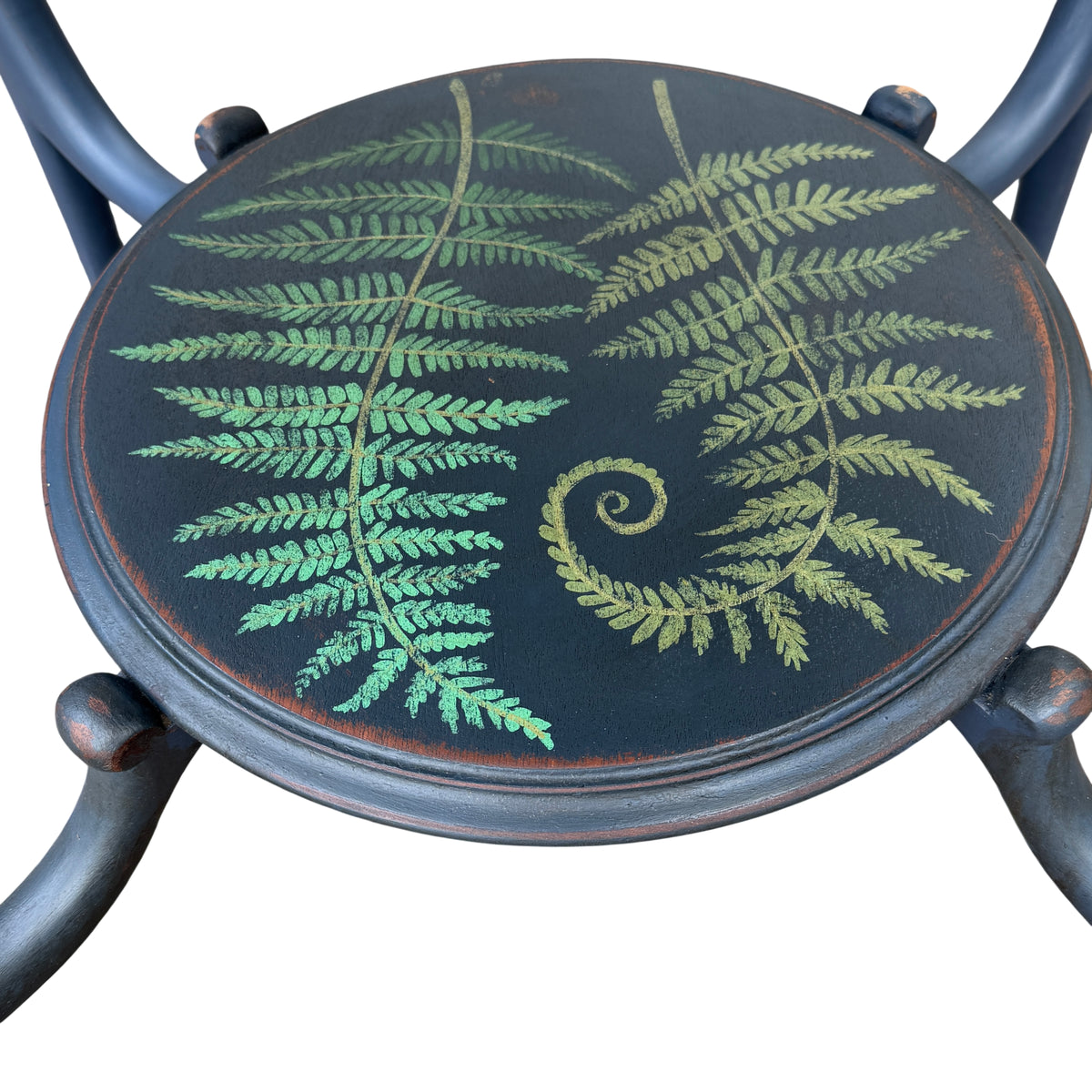 Two-tier painted hall table showing lower painted shelf with fern motif and cabriole legs