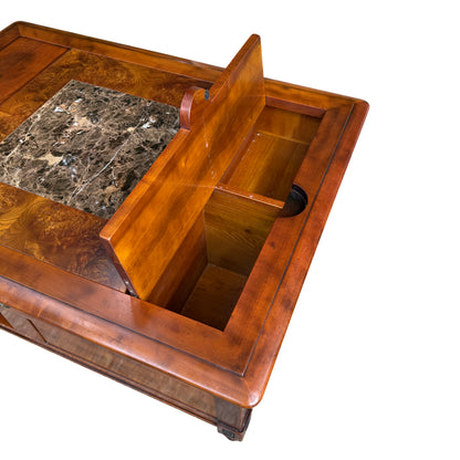 Close-up of marble insert set within a burl veneered top on coffee table