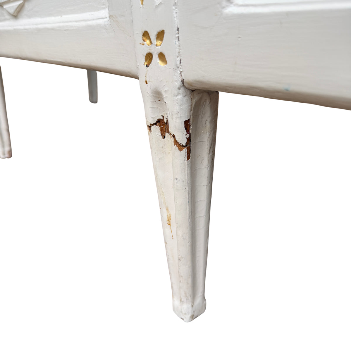 Front panel of daybed with carved diamond moulding detail and painted finish
