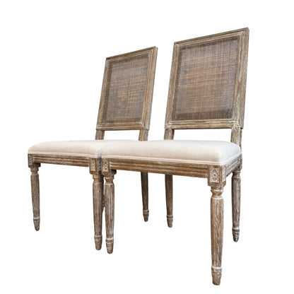 Close-up of woven cane back on French-style dining chair