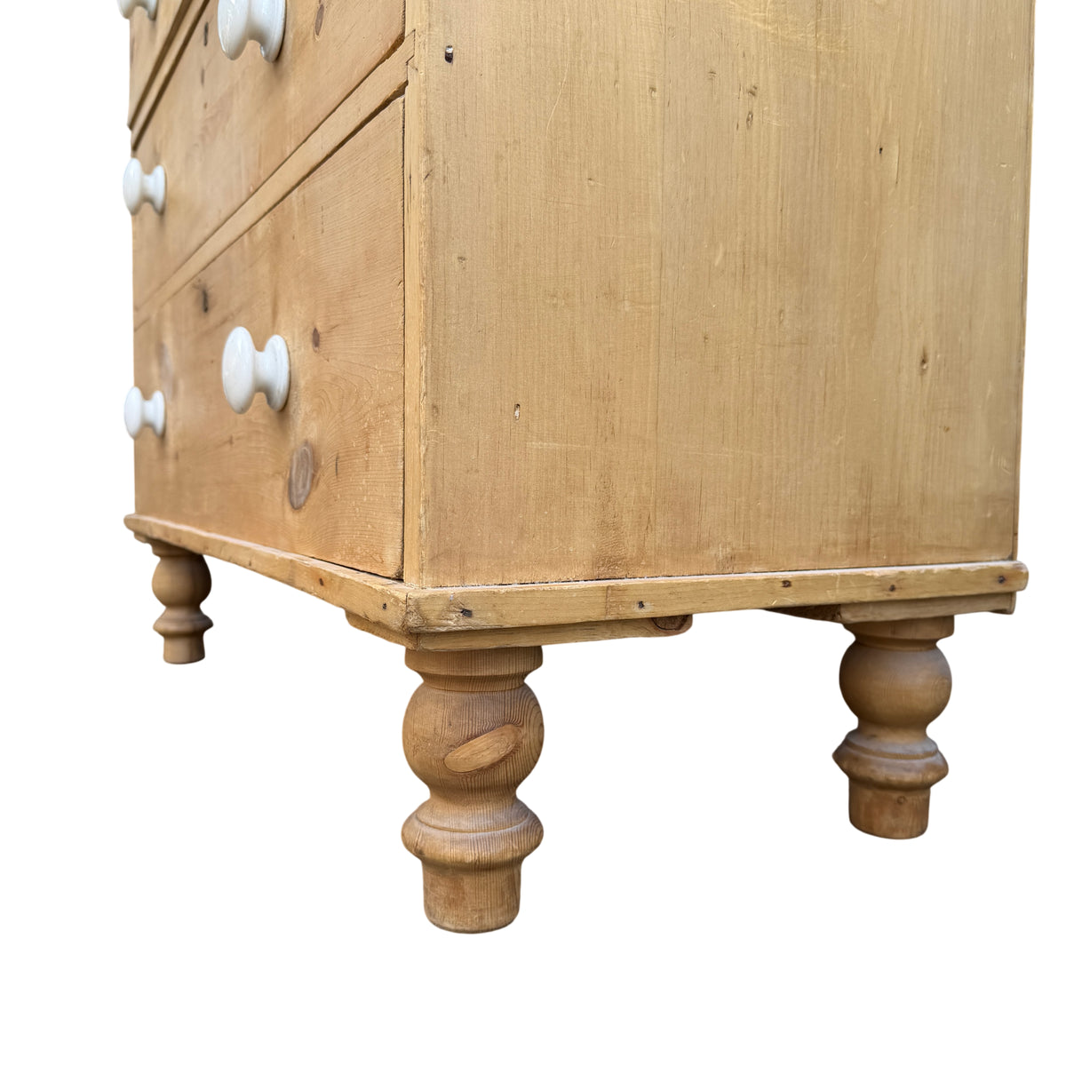 Top view of pine chest showing worn finish and small knots in the timber