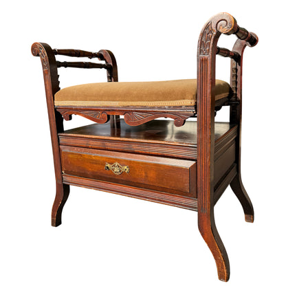 Victorian adjustable upholstered piano stool with carved scrolled arms, turned spindles and drawer