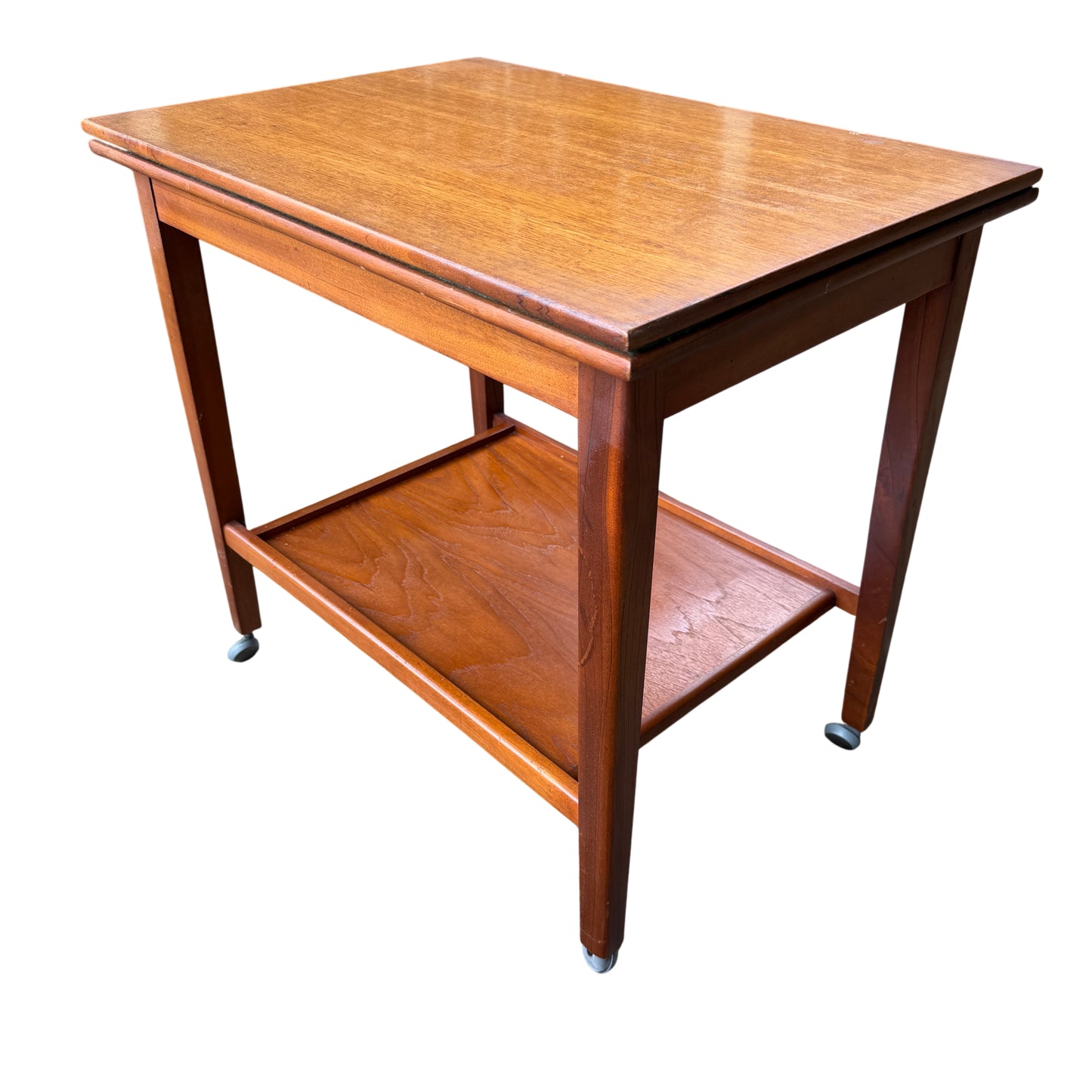 Close detail of wood grain and varnish around the edge of the folding card table